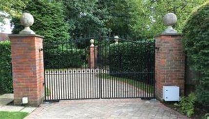 Metal gates Metal gates with brick pillars